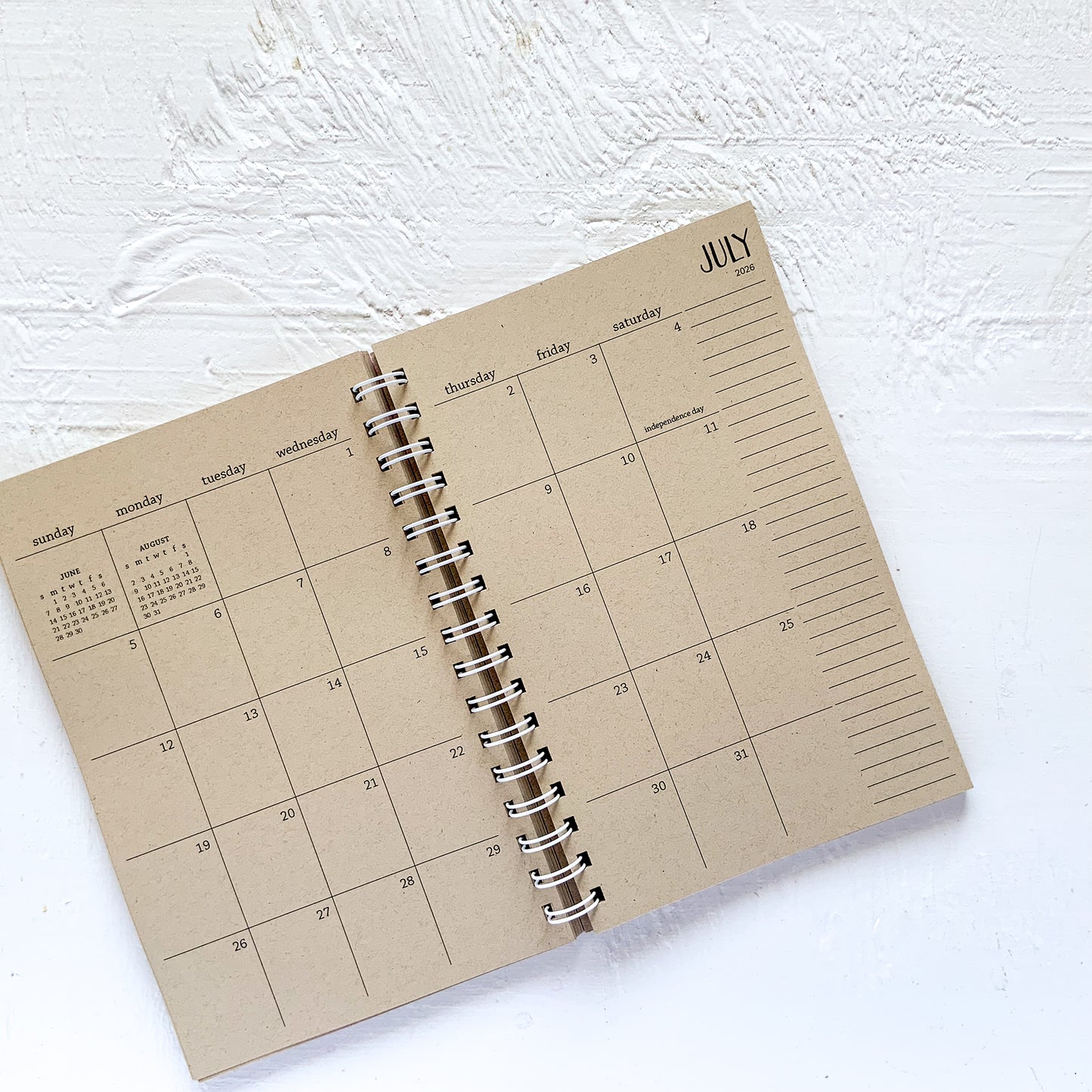 3 year small kraft monthly spiral planner | pages between months | start any time