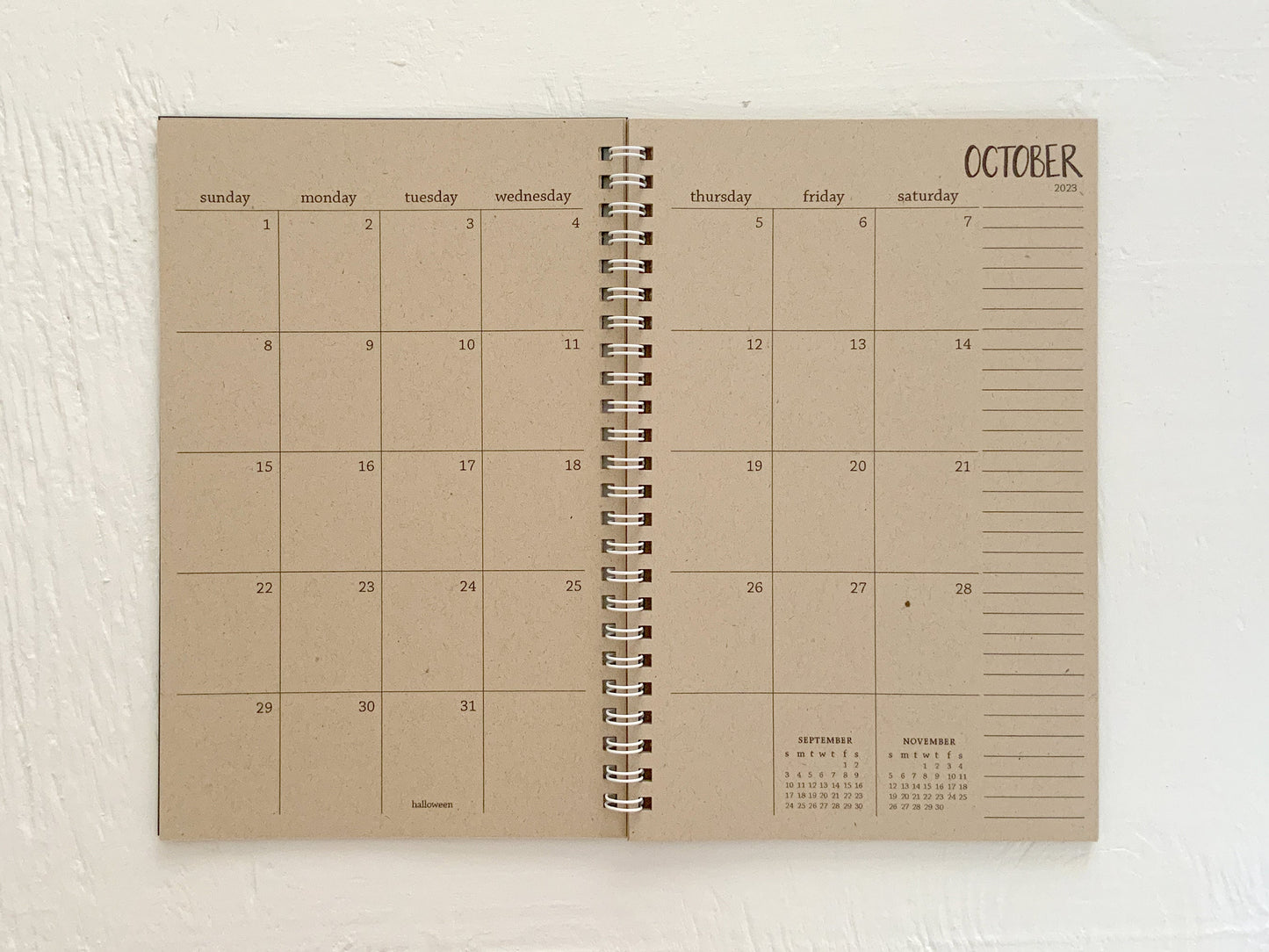 small kraft monthly spiral planner | pages between months | start anytime