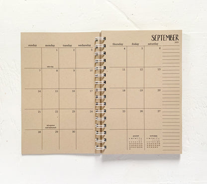 2025 small kraft monthly spiral planner | pages between months