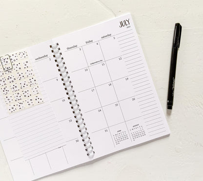 2025 small monthly spiral planner | pages between months