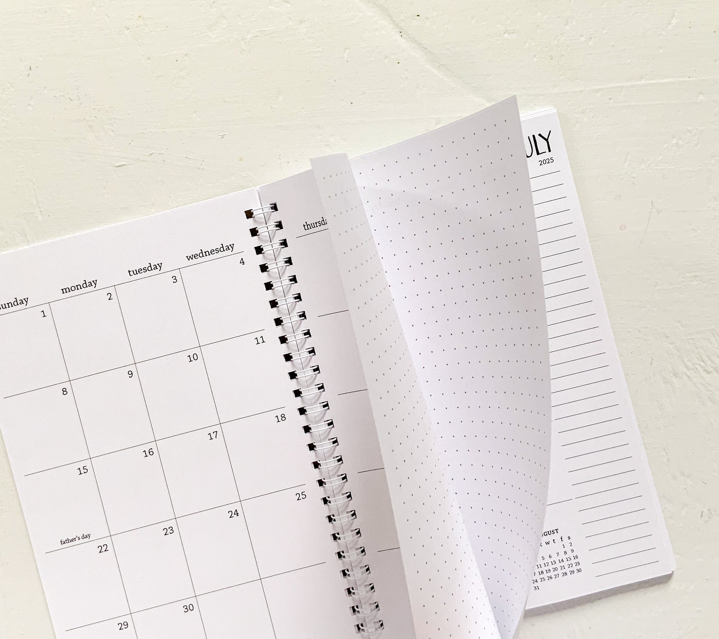 2025 small monthly spiral planner | pages between months