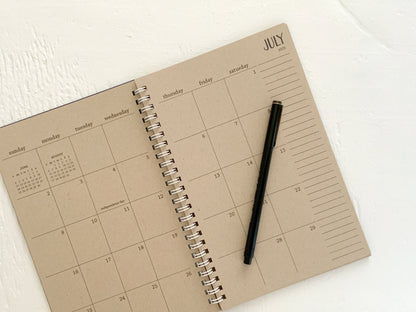 small kraft monthly spiral planner | pages between months | start anytime