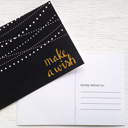 black, white and gold make a wish postcards