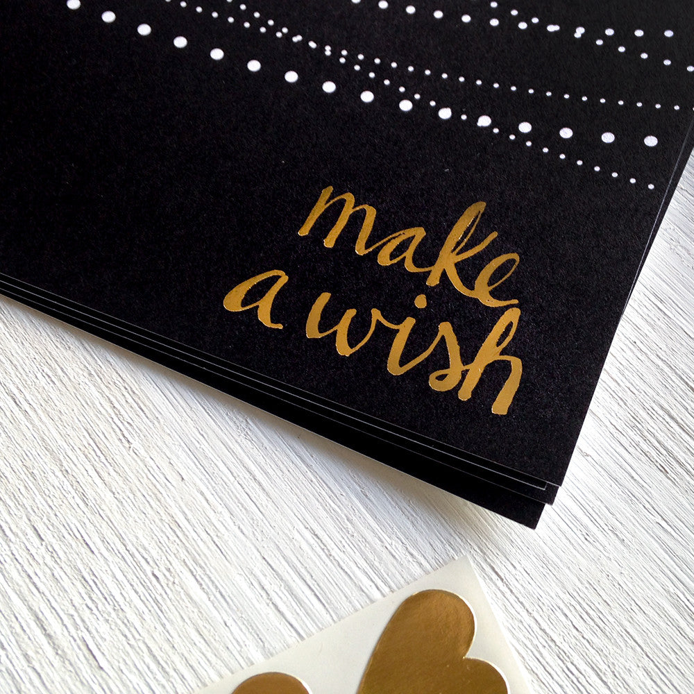 black, white and gold make a wish postcards