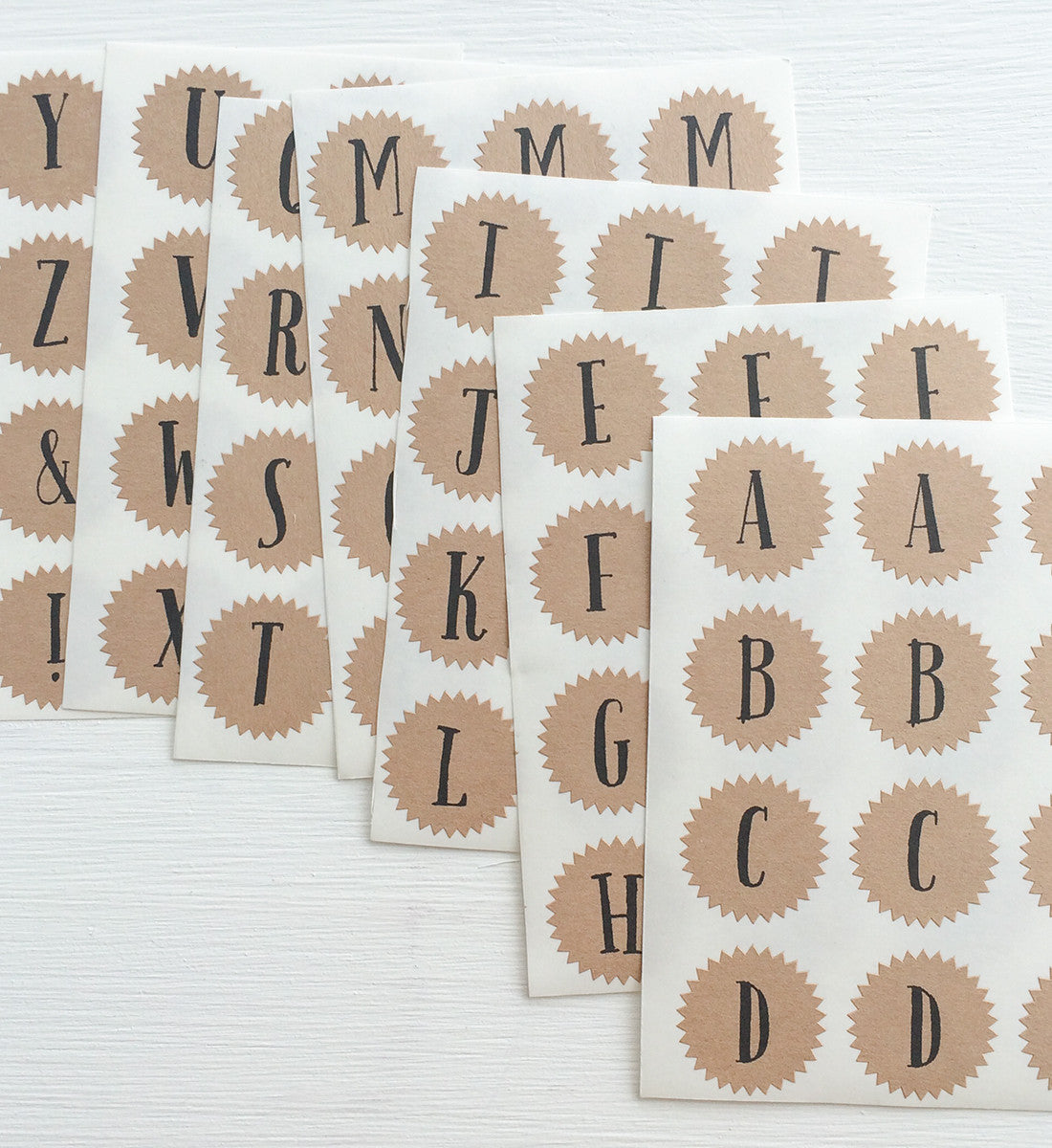 tiny kraft starburst stickers - alphabet