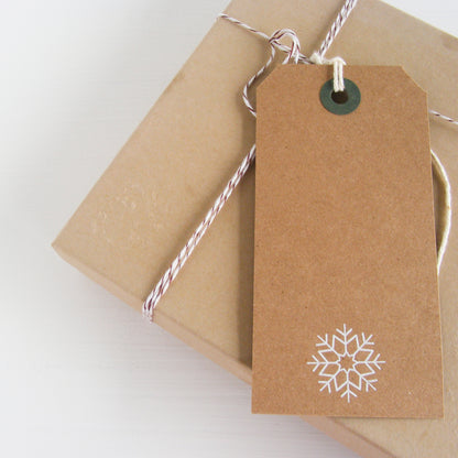 kraft gift tag with white foil snowflake